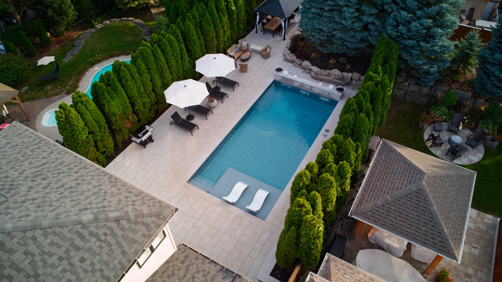 Interlocking Backyard Makeover with Custom Pool & Stonework