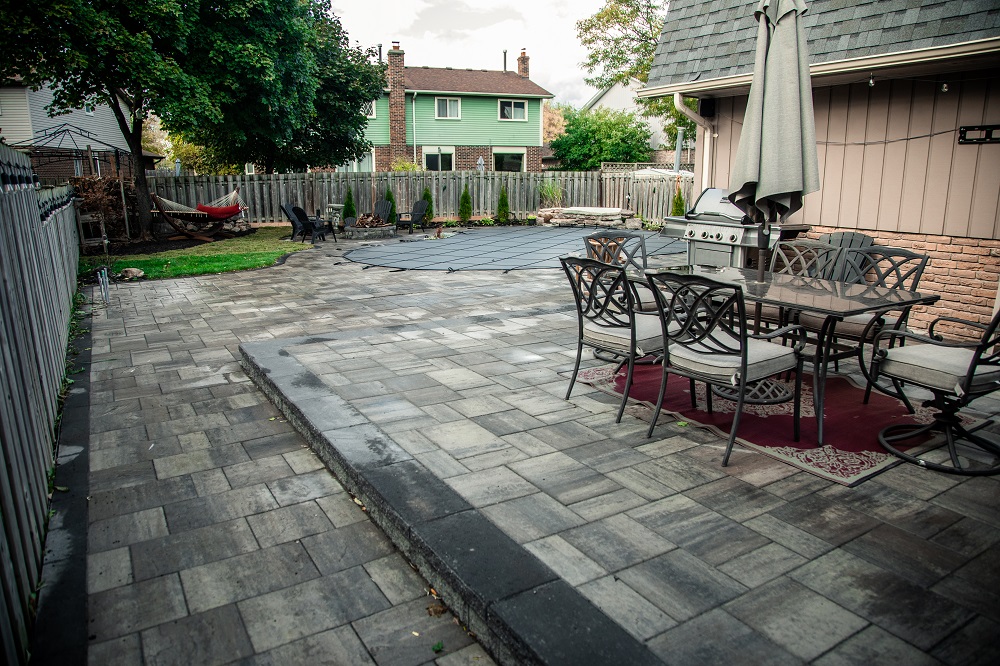 Full Backyard Renovation with Interlocking Pool Deck and Fire Pit