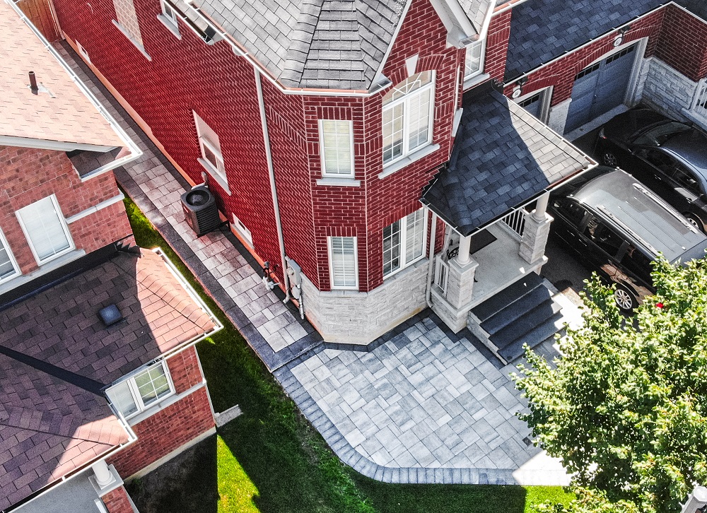 Elegant Outdoor Transformation from Driveway to Back Patio with Interlock